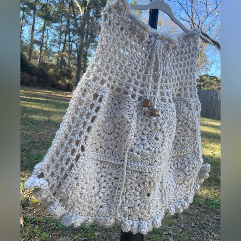 Hand crotched granny patch skirt with mesh stitching.